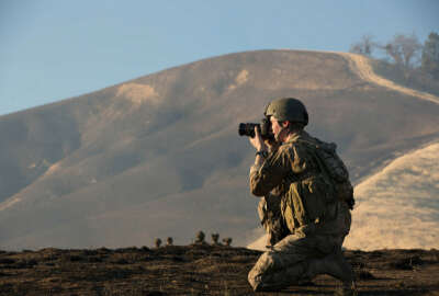 

U.S. Army Spc. Steven Hitchcock, assigned to the 55th Signal Company (Combat Camera), takes a photographs during a mission at Fort Hunter Liggett, Calif., Jan. 22, 2014. Hitchcock's mission was to document task force training conducted by Soldiers with the 2nd Battalion, 75th Ranger Regiment. (DoD photo by Pfc. Rashene Mincy, U.S. Army/Released)
