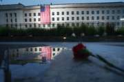 A U.S. flag is unfurled at sunrise on Tuesday, Sept. 11, 2018, at the Pentagon on the 17th anniversary of the Sept. 11, 2001, terrorist attacks. (AP Photo/Pablo Martinez Monsivais)