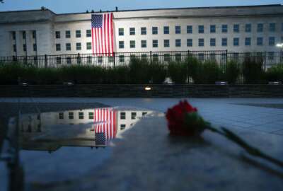 A U.S. flag is unfurled at sunrise on Tuesday, Sept. 11, 2018, at the Pentagon on the 17th anniversary of the Sept. 11, 2001, terrorist attacks. (AP Photo/Pablo Martinez Monsivais)