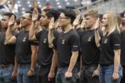 FILE - In this June 4, 2017, file photo. nNew Army recruits take part in a swearing in ceremony before a baseball game between the San Diego Padres and the Colorado Rockies in San Diego. The Army has missed its recruiting goal for the first time in more than a decade. Army leaders tell The Associated Press they signed up about 70,000 new troops for the fiscal year that ends Sept. 30, 2018. (AP Photo/Gregory Bull, File)