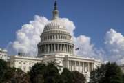 FILE- In this Sept. 3, 2018, file photo an American flag flies on the U.S. Capitol in Washington. On Thursday, Sept. 13, the Treasury Department releases federal budget data for August. (AP Photo/J. Scott Applewhite, File)