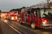 Multiple fire trucks from surrounding communities arrive Thursday, Sept. 13, 2018, in Lawrence, Mass., responding to a series of gas explosions and fires triggered by a problem with a gas line that feeds homes in several communities north of Boston. (AP Photo/Phil Marcelo)