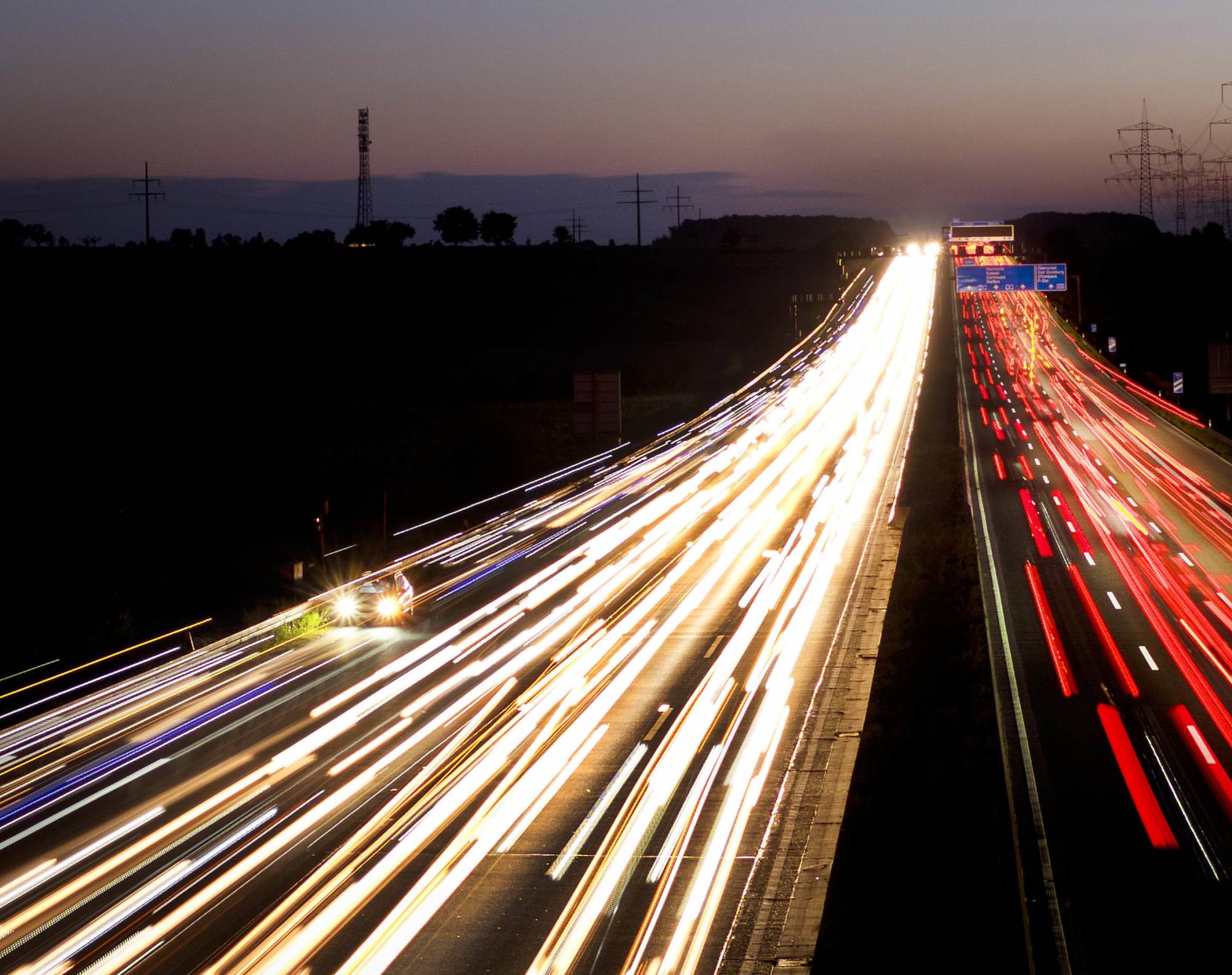 A car with a breakdown stands on the emergency lane on a highway in Frankfurt, Germany, as thousands of commuters pass by early Monday, Sept. 24, 2018. (AP Photo/Michael Probst)