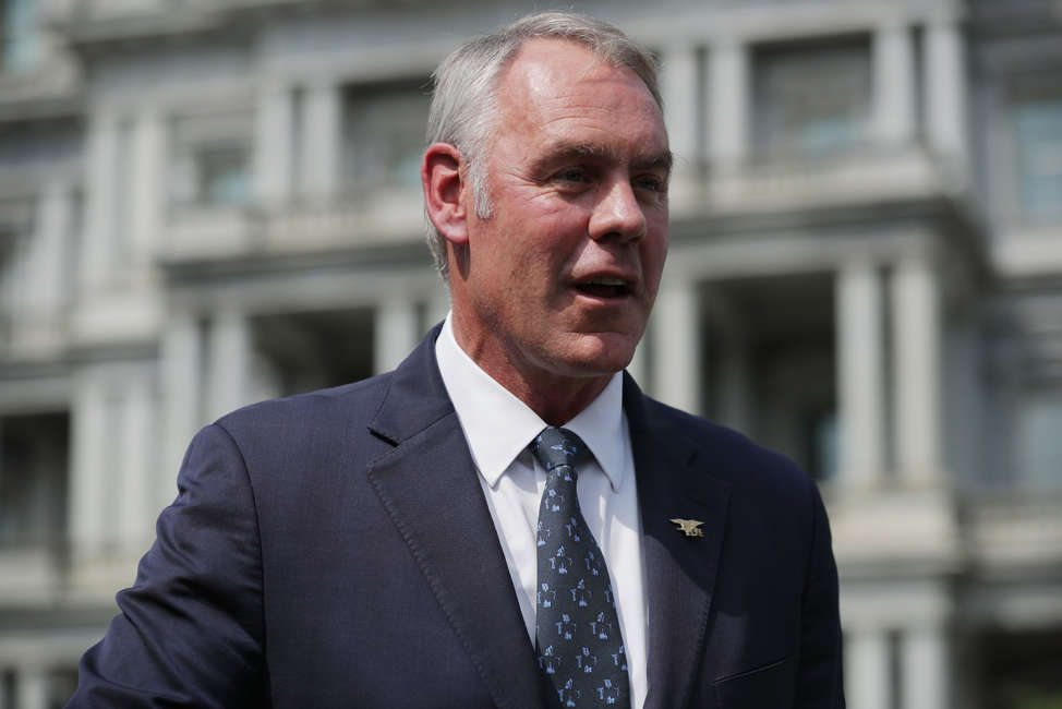 WASHINGTON, DC - AUGUST 16:  Interior Secretary Ryan Zinke talks to journalists outside the White House West Wing before attending a cabinet meeting with President Donald Trump August 16, 2018 in Washington, DC. Zinke said the historic wild fires in the west are caused by mismanaged public lands and "environmental terrorists groups" that work to prevent logging and clearing dead trees and debris that fuel fires.  (Photo by Chip Somodevilla/Getty Images)