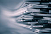 the extreamely close up  report paper stacking of office working document , retro color tone