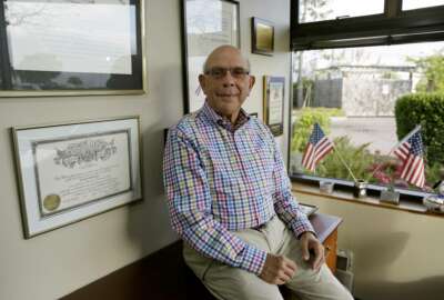 In this Tuesday, Sept. 25, 2018, photo Gerry Goldsholle poses for a photo in his office in Sausalito, Calif. Goldsholle just celebrated his 78th birthday, and he's still working. Close to one in five Americans who's 65 or older is still working, the highest percentage in more than half a century. (AP Photo/Eric Risberg)