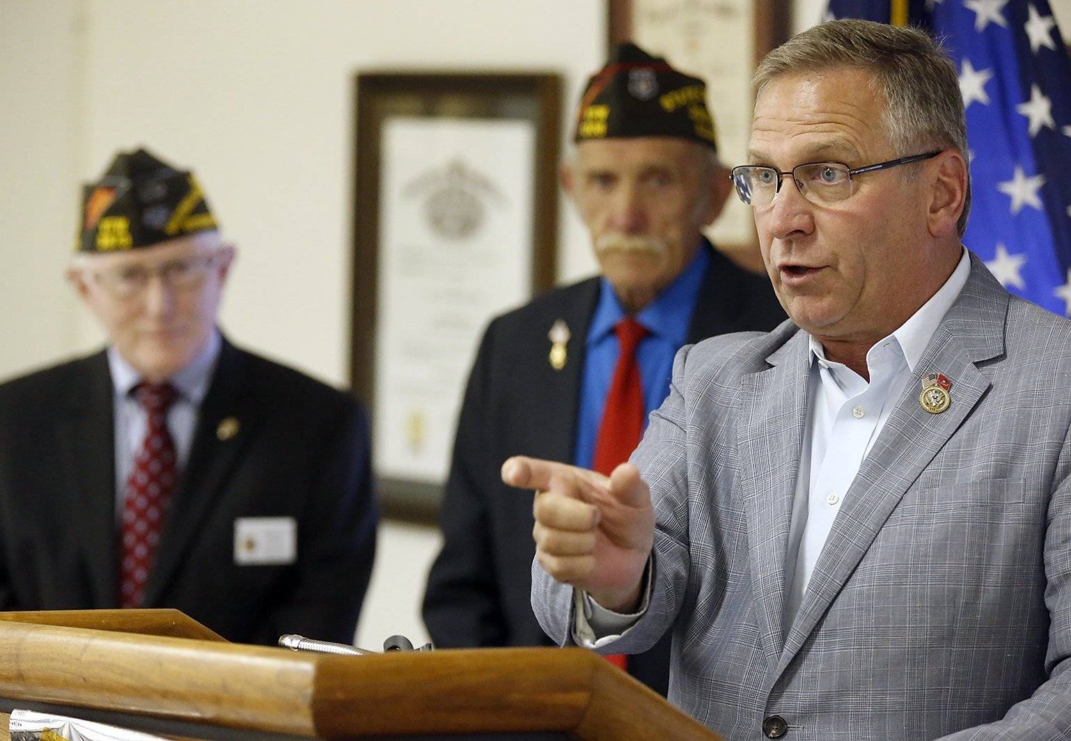 In this May 29, 2017 photo, Republican U.S. Rep. Mike Bost speaks to veterans at VFW Post  4183 in Belleville, Ill. Democrat Brendan Kelly is trying to retake a Southern Illinois House seat that Democrats held for more than 30 years before Bost won it in 2014. (Steve Nagy/Belleville News-Democrat, via AP)