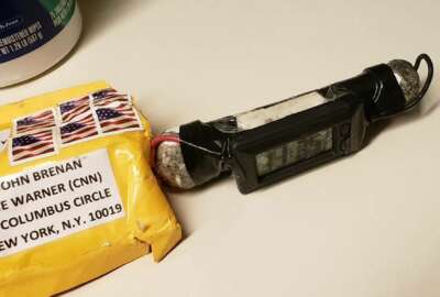 This image obtained Wednesday, Oct. 24, 2018, and provided by ABC News shows a package addressed to former CIA head John Brennan and an explosive device that was sent to CNN's New York office. The mail-bomb scare widened Thursday as law enforcement officials seized more suspicious packages. (ABC News via AP)