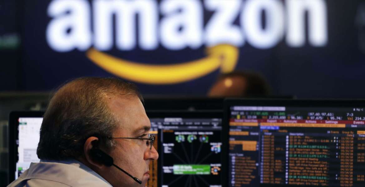 FILE- In this Sept. 4, 2018, file photo a Nasdaq employee monitors market activity in New York. Investors were ravenous for companies able to add customers and deliver fat growth. So they were willing to pay premium prices for an Amazon or a Netflix. Left behind were stocks in more staid industries, even if they had more attractive prices relative to their profits. (AP Photo/Mark Lennihan, File)