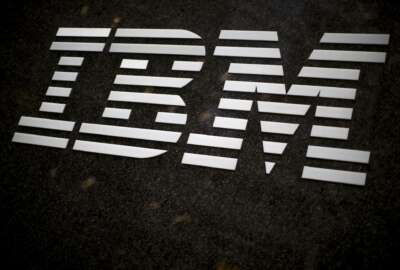 FILE - In this April 26, 2017, file photo, the IBM logo is displayed on the IBM building in Midtown Manhattan, in New York. IBM announced Sunday, Oct. 28, 2018, it will acquire North Carolina-based open-source software company Red Hat in a $34 billion stock deal that the technology and consulting giant's chief executive says will advance the company to the next step in cloud computing. (AP Photo/Mary Altaffer, File)