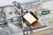 Chain And Padlock Around Dollar Bundle