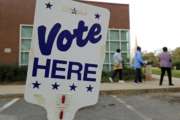 FILE- In this Oct. 23, 2018, file photo people arrive for early voting at a polling place in Charlotte, N.C. Companies aren’t required to shut down on Nov. 6, for the election, but many give their staffers paid time off to go to the polls , 44 percent, according to a survey by the Society for Human Resources Management, a trade group. Small business owners who wonder what to do should first check their state and local laws. (AP Photo/Chuck Burton, File)