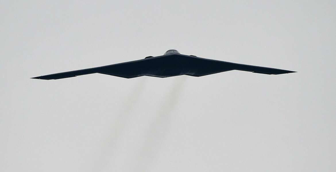 FILE - In this Oct. 25, 2015, file photo, a U.S. Air Force B2 Spirit stealth bomber performs a flyover at the Talladega Superspeedway in Talladega, Ala. The Air Force says a Missouri-based B2 landed in Colorado Springs, Colo., on Tuesday, Oct. 23, 2018, after an unspecified emergency. Neither of the pilots was injured. (AP Photo/Mark Almond, File)