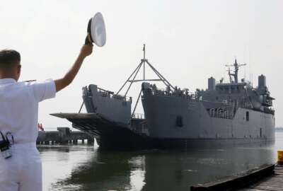 In this Wednesday, Oct. 17, 2018, file photo, a Philippine Navy officer waves at the departing landing ship BRP Dagupan City during send-off ceremony to take part in the first-ever ASEAN-China Maritime Exercise 2018 in Zhanjiang, China west of Manila, Philippines. About 200 Philippine Navy contingent will take part in the Oct. 21-28, 2018 exercise with China which focuses on maritime safety and rescue at sea. (AP Photo/Bullit Marquez, File)