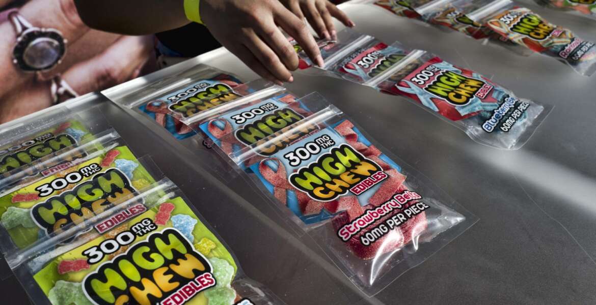 In this Saturday, Oct. 20, 2018 photo medicated High Chew edibles are shown on display and offered for sale at the cannabis-themed Kushstock Festival at Adelanto, Calif. Utah lawmaker Sen. Jim Dabakis drove to Las Vegas and tried marijuana for the first time ahead of an upcoming vote on a proposition that would legalize the medical use of marijuana in his state for individuals with qualifying medical conditions. Salt Lake City TV station KUTV reports Dabakis wanted to try cannabis before the vote. Dabakis selected an edible gummy bear for the test, saying legislators should at least try marijuana before it's up for vote next month. (AP Photo/Richard Vogel)