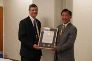 Rob Leahy (left) accepts a certificate of recognition for his almost two years at OPM from former Director Jeff Pon.