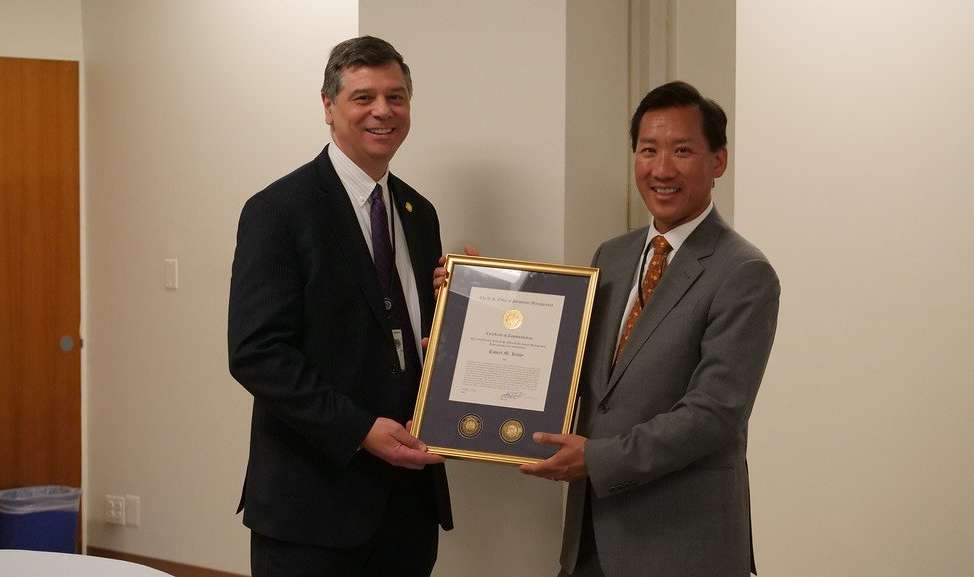 Rob Leahy (left) accepts a certificate of recognition for his almost two years at OPM from former Director Jeff Pon.