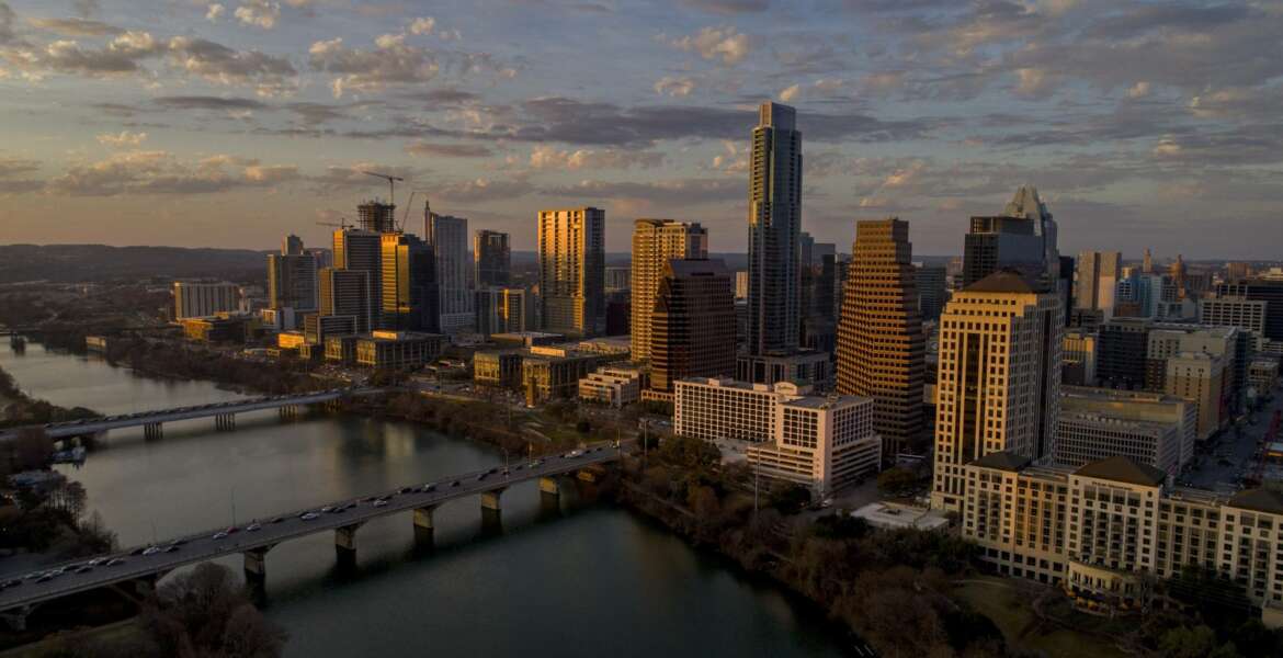 FILE - This Feb. 7, 2018, file photo shows the skyline in Austin, Texas. For more than a year, cities around the country, including Austin, waited in suspense over whether they'd be chosen as Amazon's second home. On Tuesday, Nov. 13, Amazon announced that it had picked for its new East Coast headquarters the New York neighborhood of Long Island City, Queens as well as a suburb of Washington, in Arlington, Va. (Jay Janner/Austin American-Statesman via AP, File)