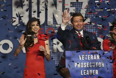 Ron DeSantis and his wife Casey celebrate after winning the Florida Governor's race during DeSantis' party at the Rosen Centre in Orlando on Orlando, Fla., on Tuesday, Nov. 6, 2018. (Stephen M. Dowell/Orlando Sentinel via AP)