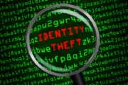 Identity Theft revealed in computer code through magnifying glass