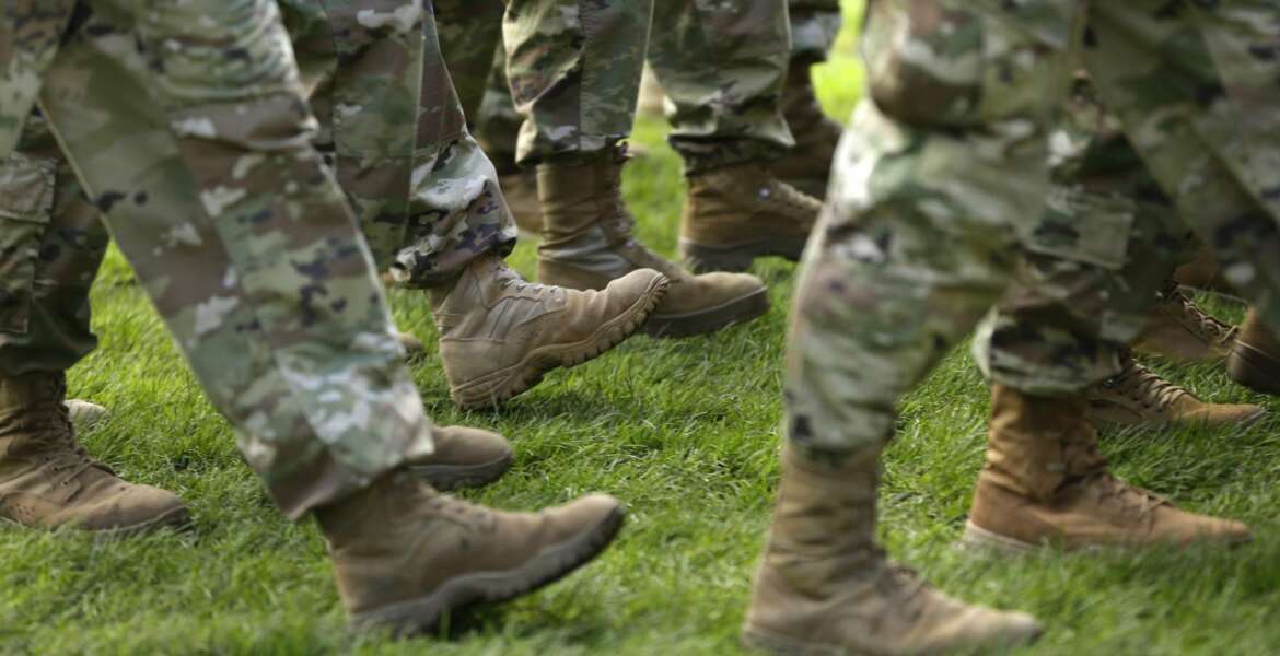 FILE- In this April 3, 2017, file photo U.S. Army soldiers march in formation during a change of command ceremony at Joint Base Lewis-McChord in Washington. If you’re a veteran with student debt, you have repayment rights unique to military service members that can keep you on track and out of default. (AP Photo/Ted S. Warren, File)