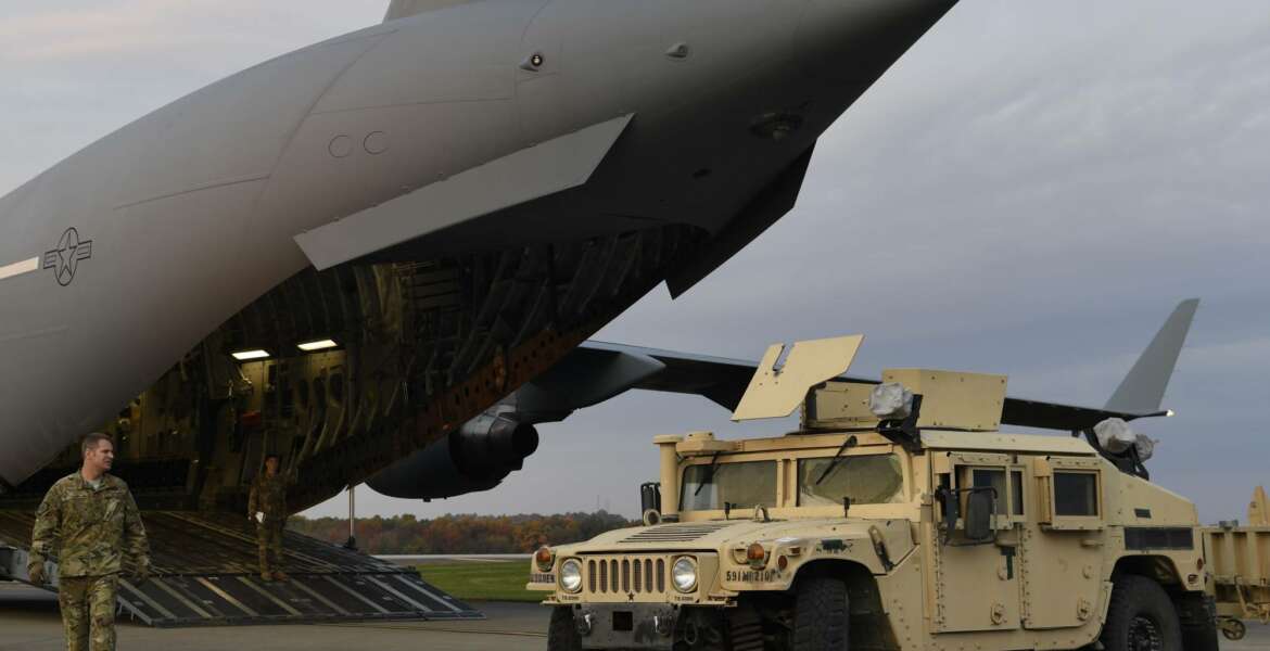 In this Oct. 31, 2018, photo provided by the U.S. Air Force, Master Sgt. Matt Conn, a loadmaster with the 21st Airlift Squadron, Travis Air Force Base, Calif., directs an Army HMMWV into a C-17 Globemaster III at Ft. Knox, Ky., to assist Department of Homeland Security along the southwest border. Defense Secretary Jim Mattis has left no doubt his top priority as leader of the military is making it more “lethal” _ better at war and more prepared for it. And yet, nothing about the military’s new mission at the U.S.-Mexico border advances that goal.  (Airman First Class Daniel A. Hernandez/U.S. Air Force via AP)