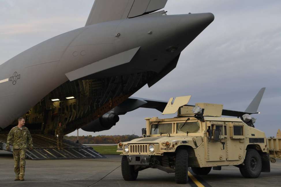 In this Oct. 31, 2018, photo provided by the U.S. Air Force, Master Sgt. Matt Conn, a loadmaster with the 21st Airlift Squadron, Travis Air Force Base, Calif., directs an Army HMMWV into a C-17 Globemaster III at Ft. Knox, Ky., to assist Department of Homeland Security along the southwest border. Defense Secretary Jim Mattis has left no doubt his top priority as leader of the military is making it more “lethal” _ better at war and more prepared for it. And yet, nothing about the military’s new mission at the U.S.-Mexico border advances that goal.  (Airman First Class Daniel A. Hernandez/U.S. Air Force via AP)