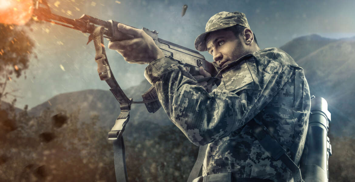 man in military gear shooting action with mountains on background game
