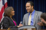 House Information Technology subcommittee Chairman Rep. Will Hurd, R-Texas, talks with Rep. Robin Kelly, D-Ill. on Capitol Hill in Washington, March 18, 2015, before the start of the subcommittee's hearing on Cybersecurity.