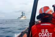 Coast Guard members return to the Coast Guard Cutter John Midgett aboard a small boat while the crew of the cutter operates near Dutch Harbor, Alaska, April 30, 2018. In order to return to his ship, Fireman Taylor Martin flew to Dutch Harbor, spent the night on the Coast Guard Cutter SPAR, and then joined this small boat crew the following morning. U.S. Coast Guard photo by FIreman Taylor Martin.