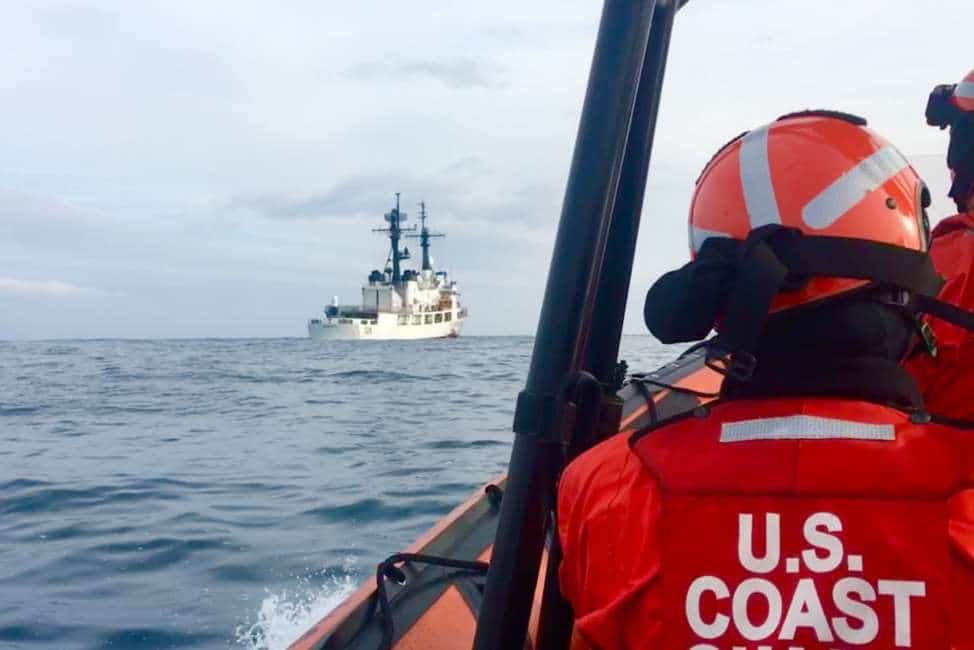 Coast Guard members return to the Coast Guard Cutter John Midgett aboard a small boat while the crew of the cutter operates near Dutch Harbor, Alaska, April 30, 2018. In order to return to his ship, Fireman Taylor Martin flew to Dutch Harbor, spent the night on the Coast Guard Cutter SPAR, and then joined this small boat crew the following morning. U.S. Coast Guard photo by FIreman Taylor Martin.