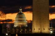 The U.S. Capitol dome is seen past the base of the Washington Monument just before sunrise in Washington, Saturday, Dec. 22, 2018. Hundreds of thousands of federal workers faced a partial government shutdown early Saturday after Democrats refused to meet President Donald Trump's demands for $5 billion to start erecting a border wall with Mexico. Overall, more than 800,000 federal employees would see their jobs disrupted, including more than half who would be forced to continue working without pay. (AP Photo/Carolyn Kaster)