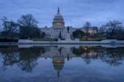 The Capitol is seen under early morning skies in Washington, Thursday, Dec. 20, 2018. The Senate approved legislation to temporarily fund the government late last night, a key step toward averting a federal shutdown after President Donald Trump backed off his demand for money for a border wall with Mexico.  The House is expected to vote before Friday's deadline, when funding for a portion of the government expires. Without resolution, more than 800,000 federal workers would face furloughs or be forced to work without pay, disrupting government operations days before Christmas. (AP Photo/J. Scott Applewhite)