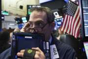 Trader Gregory Rowe works at the New York Stock Exchange, Wednesday, Dec. 12, 2018, in New York. (AP Photo/Mark Lennihan)