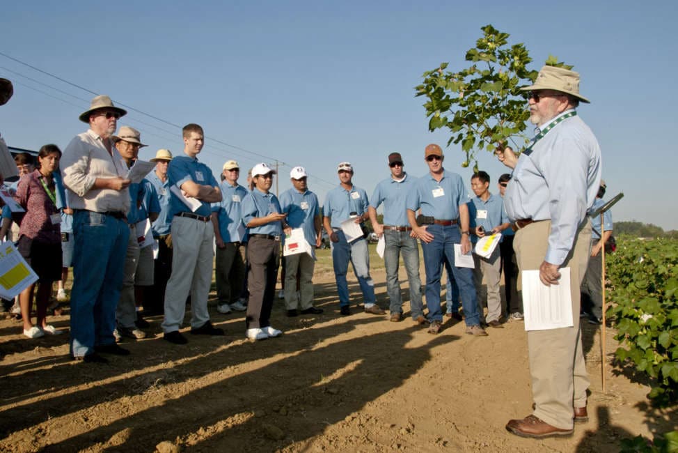 Johnie Jenkins, a U.S. Department of Agriculture researcher, discussed ongoing Mississippi State University and USDA research with cotton researchers and breeders touring facilities in the mid-South. This group gathered at MSU’s R.R. Foil Plant Science Research Center. (Photo by MSU Ag Communications/Scott Corey)