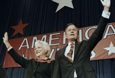FILE - In this Nov. 8, 1988 file photo, President-elect George H.W. Bush and his wife Barbara wave to supporters in Houston, Texas after winning the presidential election. Bush has died at age 94. Family spokesman Jim McGrath says Bush died shortly after 10 p.m. Friday, Nov. 30, 2018, about eight months after the death of his wife, Barbara Bush. (AP Photo/Scott Applewhite, File)