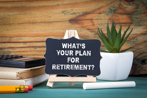 What's Your Plan for Retirement. small wooden board with chalk on the table