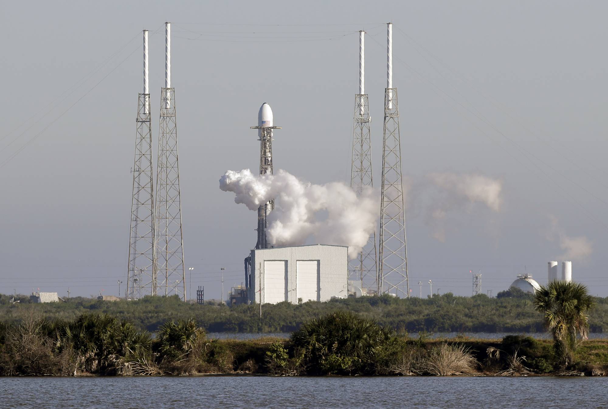 A Falcon 9 SpaceX rocket, stands ready at space launch complex 40, shortly before the launch was scrubbed because of a technical issue at the Cape Canaveral Air Force Station in Cape Canaveral, Fla., Tuesday, Dec. 18, 2018. The payload on the rocket is the U.S. Air Force's first Global Positioning System III space vehicle and the system will augment 31 current operational GPS satellites. (AP Photo/John Raoux)
