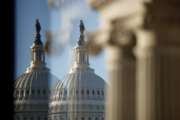 The U.S. Capitol Building Dome is seen through a beveled window at the Library of Congress in Washington, Wednesday, Dec. 19, 2018. President Donald Trump this week appears likely to pass up his last, best chance to secure funding for the “beautiful” wall he’s long promised to construct along the U.S.-Mexico border. (AP Photo/Carolyn Kaster)