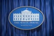 The White House Washington sign on blue background