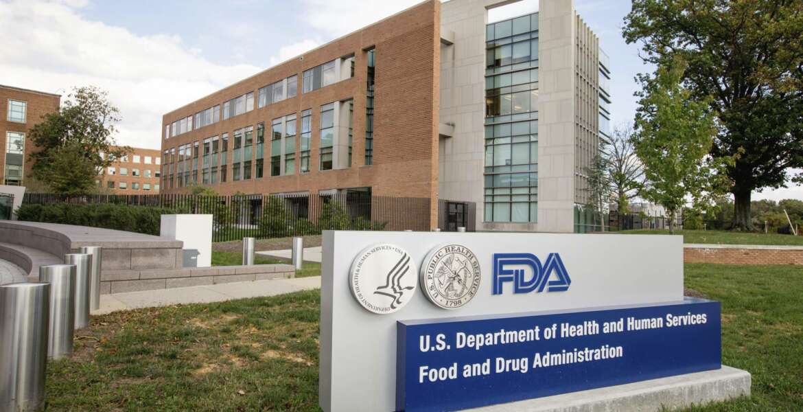 FILE - This Oct. 14, 2015, file photo shows the Food and Drug Administration campus in Silver Spring, Md. The FDA says it is resuming inspections of some of the riskiest foods such as cheeses, produce and infant formula as early as Tuesday, Jan. 15, 2019. (AP Photo/Andrew Harnik, File)