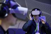 People use Oculus VR headsets at the Panasonic booth at CES International, Tuesday, Jan. 8, 2019, in Las Vegas. (AP Photo/John Locher)