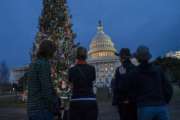 The Capitol is seen as New Year's Day comes to a close with the partial government shutdown in its second week, in Washington, Tuesday, Jan. 1, 2019. The new House majority led by Democrat Nancy Pelosi gavels into session this week with legislation ready to end the government shutdown. (AP Photo/J. Scott Applewhite)