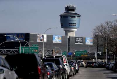 The air traffic control tower at LaGuardia Airport is seen, Friday, Jan. 25, 2019, in New York. The Federal Aviation Administration reported delays in air travel Friday because of a 