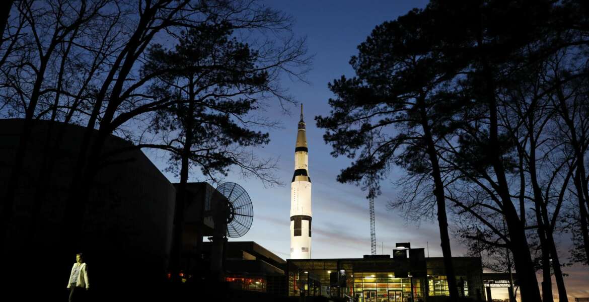 An employee leaves the state operated U.S. Space & Rocket Center which serves as the visitor center for the nearby federally funded NASA Marshall Space Flight Center, in Huntsville, Ala., Tuesday, Jan. 8, 2019. Once known for its cotton trade and watercress farms, Huntsville is the ultimate government town. About 70 federal agencies are located at the Army's sprawling Redstone Arsenal, and more than half the area economy is tied to Washington spending. (AP Photo/David Goldman)