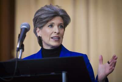 FILE - In this Dec. 11, 2018 file photo, Sen. Joni Ernst, R-Iowa, speaks during the signing of an order withdrawing federal protections for countless waterways and wetlands, at EPA headquarters in Washington. Ernst says she turned down Donald Trump's request to run as his vice president in 2016 because of family concerns. Ernst made the claim in an affidavit in a divorce proceeding in October that was first reported by CityView, a Des Moines weekly newspaper. The filing was unsealed earlier this month after Ernst and her former husband of 25 years, Gail Ernst, settled their previously contentious divorce. (AP Photo/Cliff Owen, File)