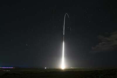 FILE - This Dec. 10, 2018, file photo, provided by the U.S. Missile Defense Agency (MDA),shows the launch of the U.S. military's land-based Aegis missile defense testing system, that later intercepted an intermediate range ballistic missile, from the Pacific Missile Range Facility on the island of Kauai in Hawaii. The Trump administration will roll out a new strategy Thursday, Jan. 17, 2019, for a more aggressive space-based missile defense system to protect against existing threats from North Korea and Iran and counter advanced weapon systems being developed by Russia and China. (Mark Wright/Missile Defense Agency via AP)
