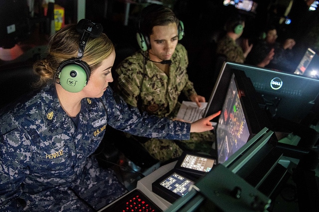 SAN DIEGO (Jan. 10, 2019) Chief Operations Specialist Anna Penrod, left, assigned to the guided-missile destroyer USS Rafael Peralta (DDG 115), and Lt. Aaron Van Driessche participate in an air defense scenario at the Combined Integrated Air and Missile Defense (IAMD) and Anti-Submarine Warfare (ASW) Trainer (CIAT). CIAT is the Navy’s newest combat systems trainer. Rafael Peralta became the first warship to pilot the advance warfare training curriculum at CIAT. (U.S. Navy photo by Mass Communication Specialist 2nd Class Nicholas Burgains/Released)190110-N-AZ808-1033