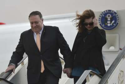 Secretary of State Mike Pompeo and his wife Susan disembark from their aircraft as they arrive in Amman, Jordan at the start of a Middle East tour, Tuesday, Jan. 8, 2019.  (Andrew Caballero-Reynolds/Pool Photo via AP)