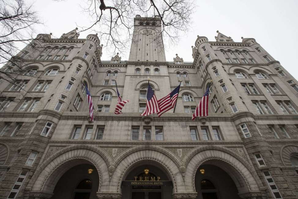 The Old Post Office Pavilion Clock Tower, which remains open during the partial government shutdown, is seen above the Trump International Hotel, Friday, Jan. 4, 2019 in Washington. (AP Photo/Alex Brandon)